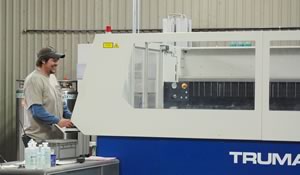 Brandon Cleghorn runs Ecodynamic's laser cutter.